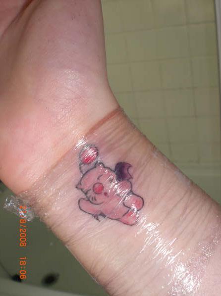  the pleasure of meeting a girl who has a Moogle tattooed on her wrist: